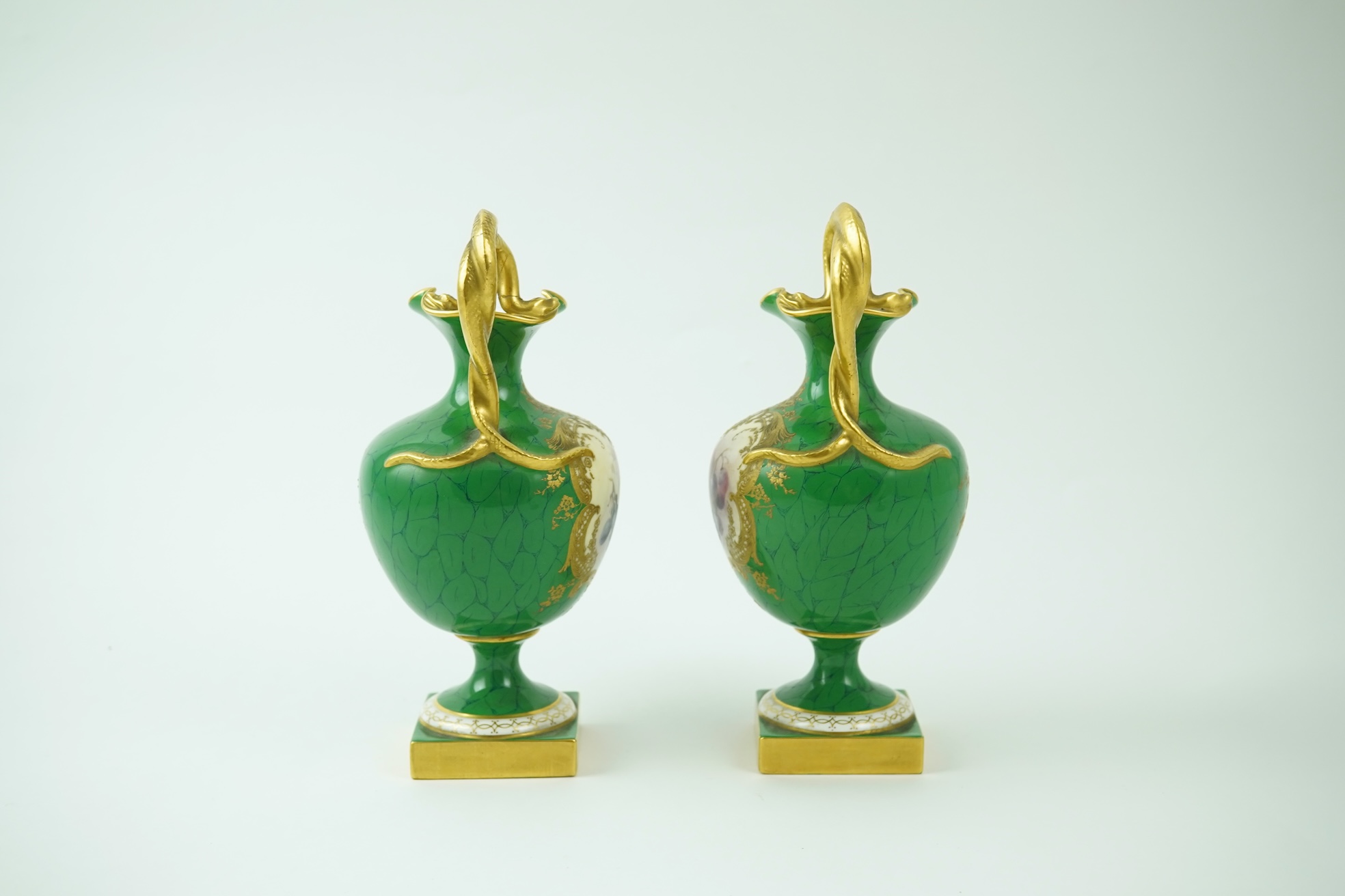 A pair of Royal Worcester fruit painted ewers, by R. Sebright, c.1903